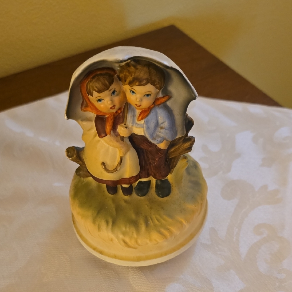 Charming Figurine of Children Under Umbrella